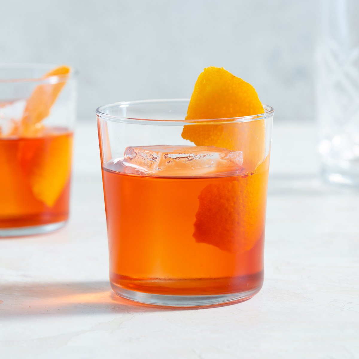 Close-up of a Negroni in a glass with an orange peel