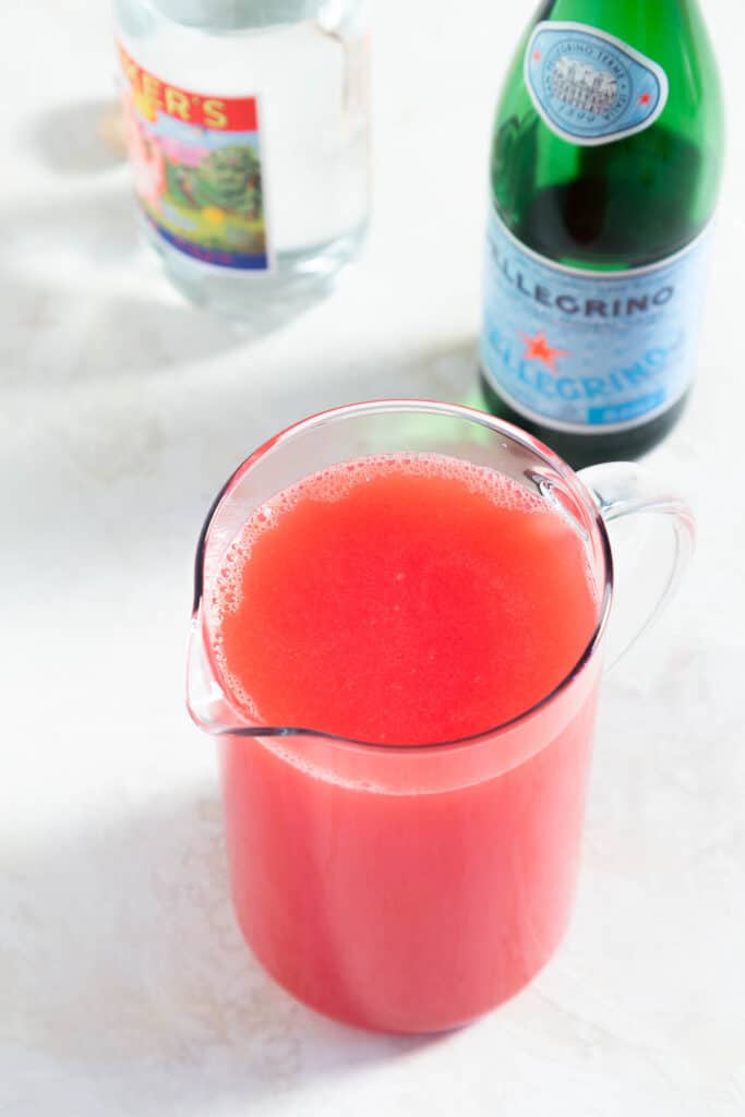Glass pitcher with pink watermelon punch