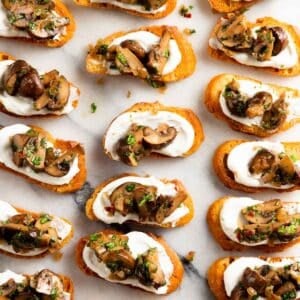 Close up of mushroom crostini on a marble slab