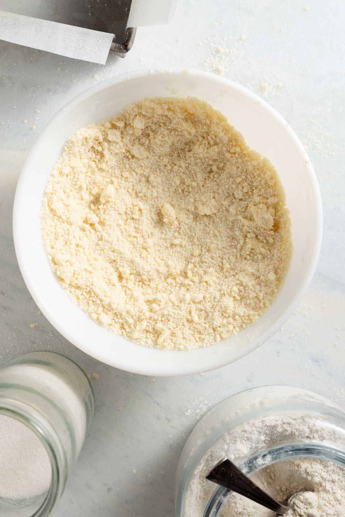 crumbly beige flour mix in a white bowl