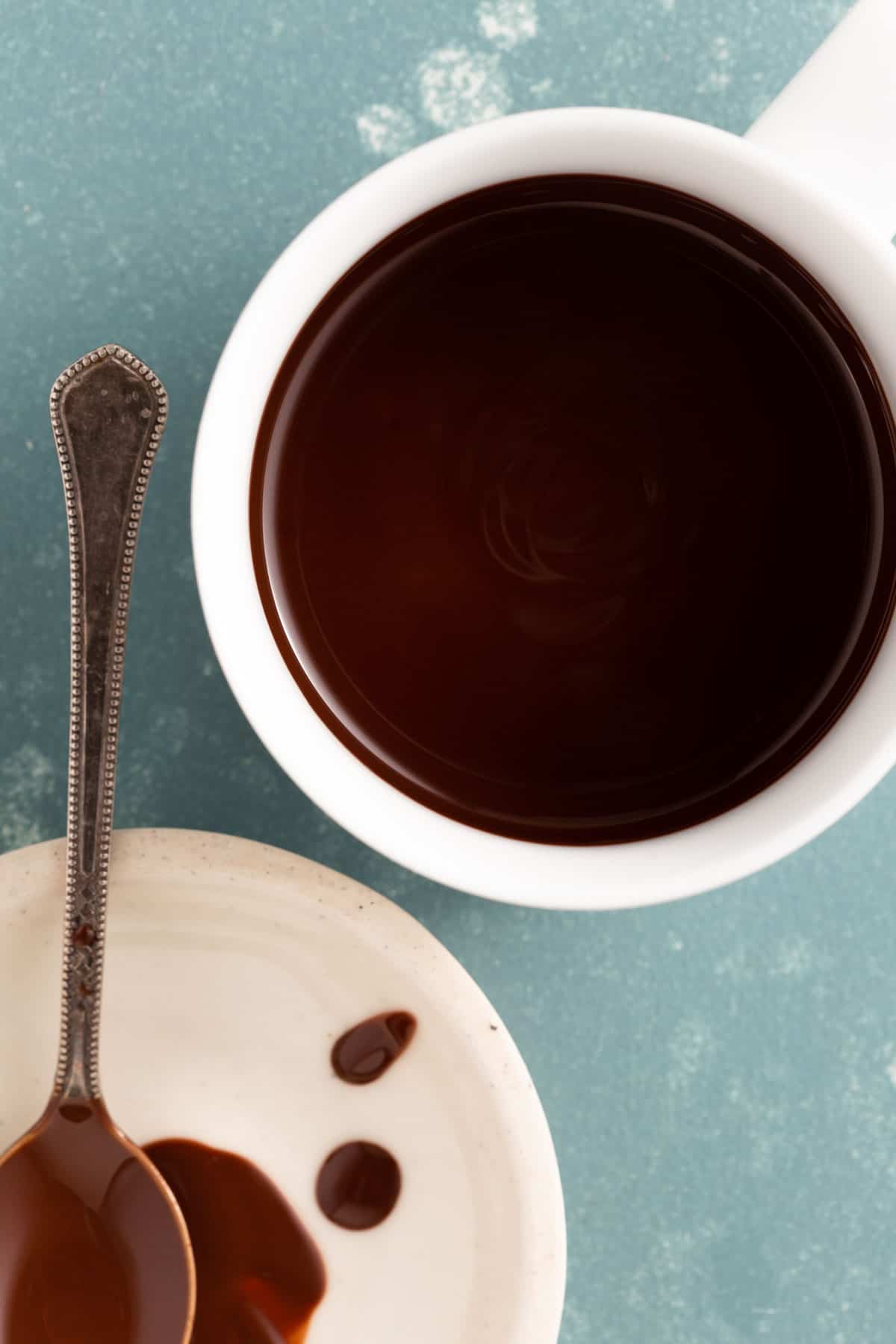 close up on a white bowl with melted chocolate